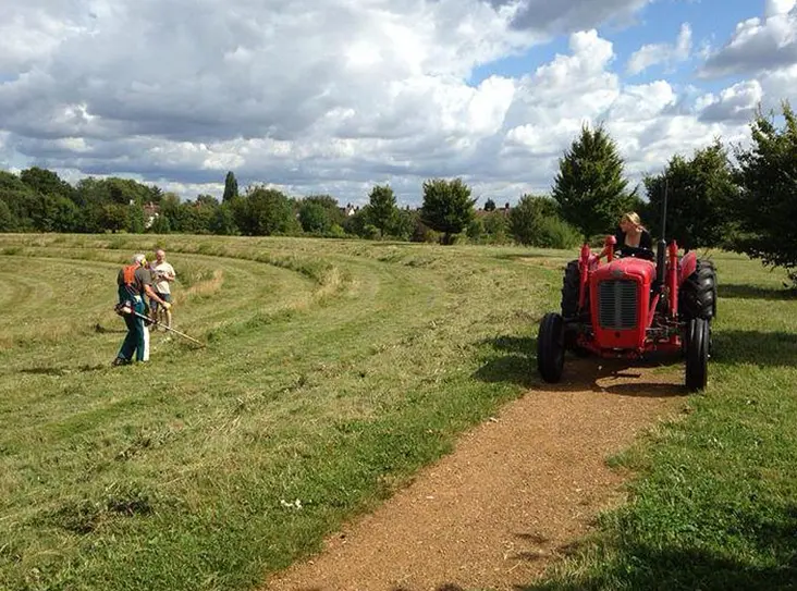 The repurposed tractor mowing